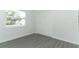 Clean empty bedroom with a white walls, vinyl flooring, and closet at 6222 Fox Hunt Trl, Orlando, FL 32808