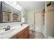 Bathroom featuring double vanity with tile floors, shower, and toilet at 6762 Tamarind Cir, Orlando, FL 32819