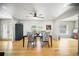 Bright dining room with wood floors, ceiling fan, and natural light, ideal for Gathering gatherings at 6762 Tamarind Cir, Orlando, FL 32819