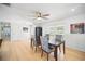 Spacious dining room with wood floors, ceiling fan, and lots of light, great for hosting dinner parties at 6762 Tamarind Cir, Orlando, FL 32819