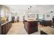 Open kitchen view featuring a center island, breakfast nook, and seamless transition to the living room at 6762 Tamarind Cir, Orlando, FL 32819