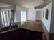 Open-concept kitchen with granite countertops, modern sink fixtures, and a view of the dining area at 721 Waxwing Ct, Kissimmee, FL 34759