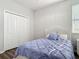 Bright bedroom with a queen bed, a closet and hardwood floors at 793 Hyperion Dr, Debary, FL 32713