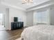 Main bedroom with a ceiling fan, a black dresser, and access to the main bath area at 793 Hyperion Dr, Debary, FL 32713