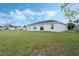 Expansive backyard featuring green grass and a white single-Gathering home at 803 Marquis Ct, Kissimmee, FL 34759