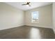 Neutral bedroom featuring a ceiling fan and a window at 803 Marquis Ct, Kissimmee, FL 34759