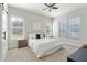 Bright bedroom with large windows, neutral tones, and comfortable bedding creating a relaxing atmosphere at 806 Roswell Cv, Lake Mary, FL 32746