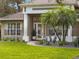 Close up view of the beautifully landscaped front entrance with a walkway and garden beds at 806 Roswell Cv, Lake Mary, FL 32746