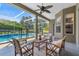 Outdoor patio with seating area overlooking a screened-in pool and lush landscaping at 806 Roswell Cv, Lake Mary, FL 32746