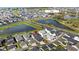 Aerial view of a residential community featuring homes near ponds and a lake at 936 Allendale Ln, Winter Garden, FL 34787