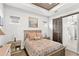 Comfortable bedroom with wood accents, a patterned duvet, and natural light at 936 Allendale Ln, Winter Garden, FL 34787