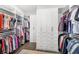 Spacious walk-in closet featuring custom organizers and ample storage space at 936 Allendale Ln, Winter Garden, FL 34787