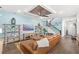 Spacious living room with wood-paneled wall, coffered ceiling, and open floor plan at 936 Allendale Ln, Winter Garden, FL 34787