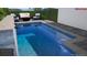 A modern pool design with patio furniture and a fire pit at 936 Allendale Ln, Winter Garden, FL 34787