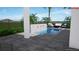 A modern pool design with patio furniture, a fire pit, and landscaping at 936 Allendale Ln, Winter Garden, FL 34787