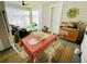 Sunroom featuring dining and seating areas, neutral rug, and decorative art at 936 Allendale Ln, Winter Garden, FL 34787