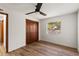 Bedroom features wood floors, a window, and a closet offering storage and natural light at 9360 Sonia St, Orlando, FL 32825