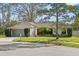 Charming single-story home featuring manicured landscaping and mature trees in a quiet neighborhood at 9360 Sonia St, Orlando, FL 32825