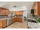 Stylish kitchen with modern countertops, wood cabinets, and stainless steel appliances at 9360 Sonia St, Orlando, FL 32825