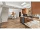 Bright kitchen and adjacent sitting area offers ample space and a skylight for natural light at 9360 Sonia St, Orlando, FL 32825