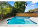 Inviting backyard pool and a privacy fence offer a serene escape at 9360 Sonia St, Orlando, FL 32825