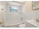 Updated bathroom featuring white subway tile, tub, and modern fixtures at 1109 Denton Rd, Winter Park, FL 32792