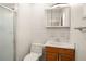 Bright bathroom featuring glass shower door, wooden vanity, and mirror at 1109 Denton Rd, Winter Park, FL 32792