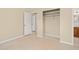 Bedroom featuring closet with shelves, door to bathroom and doorway at 1109 Denton Rd, Winter Park, FL 32792