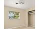 Cozy bedroom with a closet and large window, neutral walls and modern flooring at 1109 Denton Rd, Winter Park, FL 32792