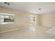 Bright room with windows overlooking the pool, neutral paint and modern flooring at 1109 Denton Rd, Winter Park, FL 32792