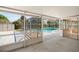 Screened-in pool area with shed and sunroom beyond the porch at 1109 Denton Rd, Winter Park, FL 32792