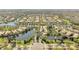 Aerial view of the Village Walk community featuring lakes and lush landscaping at 12016 Lorenza Ln, Orlando, FL 32827