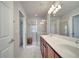 Bathroom featuring a double vanity, a large glass shower enclosure and a separate toilet room at 12016 Lorenza Ln, Orlando, FL 32827