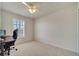 Bright bedroom with a window and carpeted floors, ideal for a home office at 12016 Lorenza Ln, Orlando, FL 32827