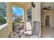 Cozy outdoor patio with seating and scenic views of the community at 12016 Lorenza Ln, Orlando, FL 32827