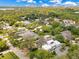 Aerial view of a neighborhood with mature trees, well-manicured lawns, and various architectural home styles at 1213 Richmond Rd, Winter Park, FL 32789