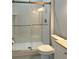 Modern bathroom features a glass door shower, toilet, and vanity at 1213 Richmond Rd, Winter Park, FL 32789