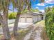 Modern home with a two-car garage, well-maintained landscaping, and a welcoming entrance, showcasing its curb appeal at 1213 Richmond Rd, Winter Park, FL 32789