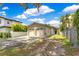 A single story home with a two car garage, a paved driveway and well kept landscaping at 1213 Richmond Rd, Winter Park, FL 32789