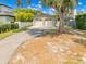 Attached two-car garage with a long driveway, providing ample parking and convenient access to the home at 1213 Richmond Rd, Winter Park, FL 32789