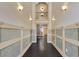 Upstairs hallway with elegant lighting, hardwood floors, and panel molding at 1213 Richmond Rd, Winter Park, FL 32789