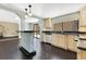 Spacious kitchen with stainless steel appliances, dark countertops, and hardwood floors at 1213 Richmond Rd, Winter Park, FL 32789