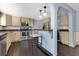 Stylish kitchen with stainless steel appliances, granite countertops and dark wood floors at 1213 Richmond Rd, Winter Park, FL 32789