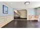 Open-concept living room with hardwood floors, stylish trim, and arched entryways at 1213 Richmond Rd, Winter Park, FL 32789