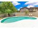 Beautiful backyard with a uniquely shaped pool, surrounded by a patio and lush landscaping for outdoor enjoyment at 1213 Richmond Rd, Winter Park, FL 32789