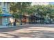 Inviting street view with outdoor seating, awnings, decorative street lamps and brick road at 1213 Richmond Rd, Winter Park, FL 32789