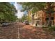 Charming street view featuring brick roads, mature trees, and beautiful building facades at 1213 Richmond Rd, Winter Park, FL 32789