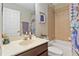 Clean bathroom featuring a bathtub, shower, and vanity with ample counter space at 124 Canterbury Bell Dr, Oviedo, FL 32765