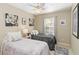 Cozy bedroom with twin beds, soft lighting, and tasteful wall decor at 124 Canterbury Bell Dr, Oviedo, FL 32765