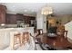 Dining area open to the kitchen with seating for four and backyard access at 124 Canterbury Bell Dr, Oviedo, FL 32765